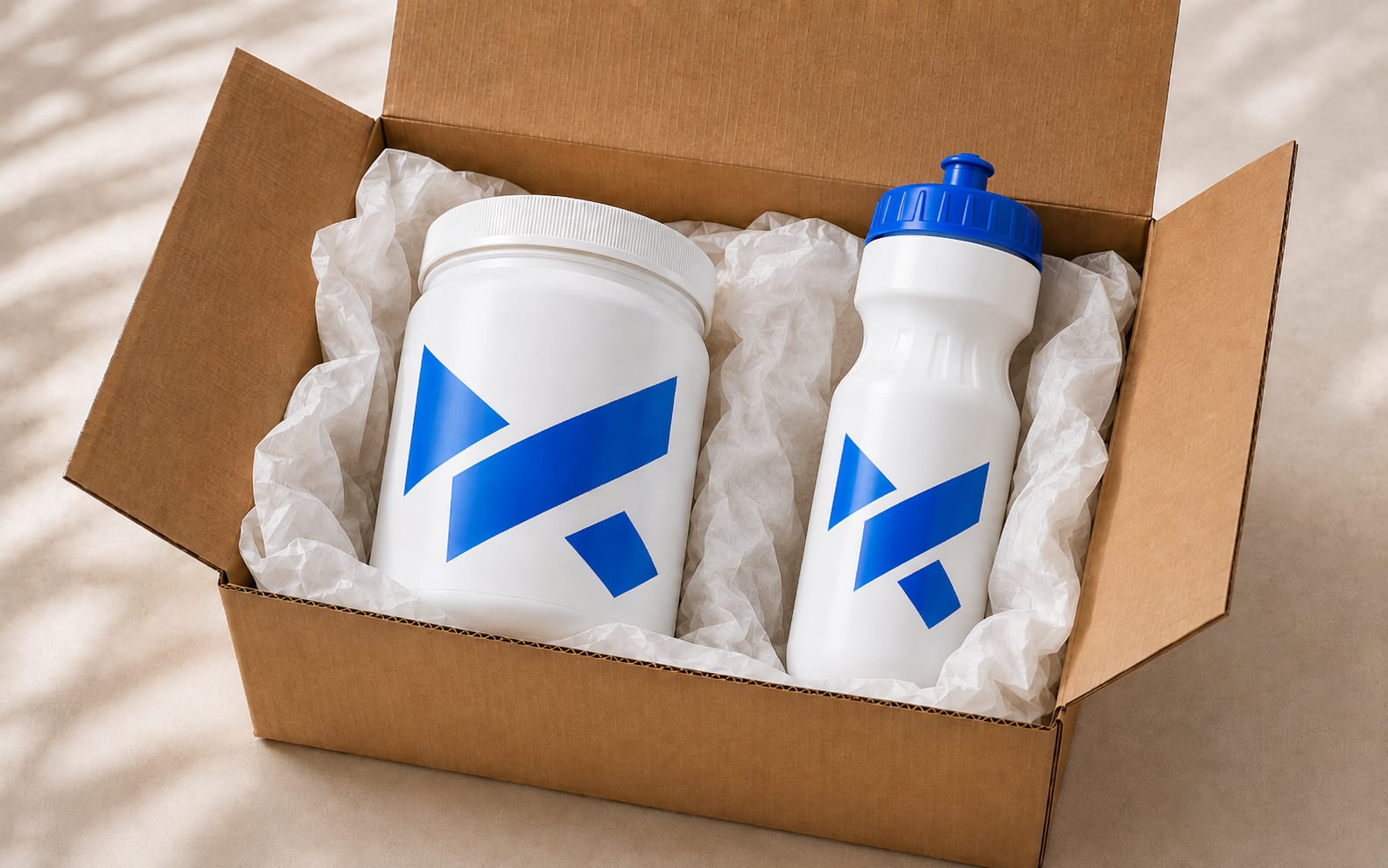 Water bottle in the design of a supplement brand, together with a powder tub and an opened shipping box as an extra with the order